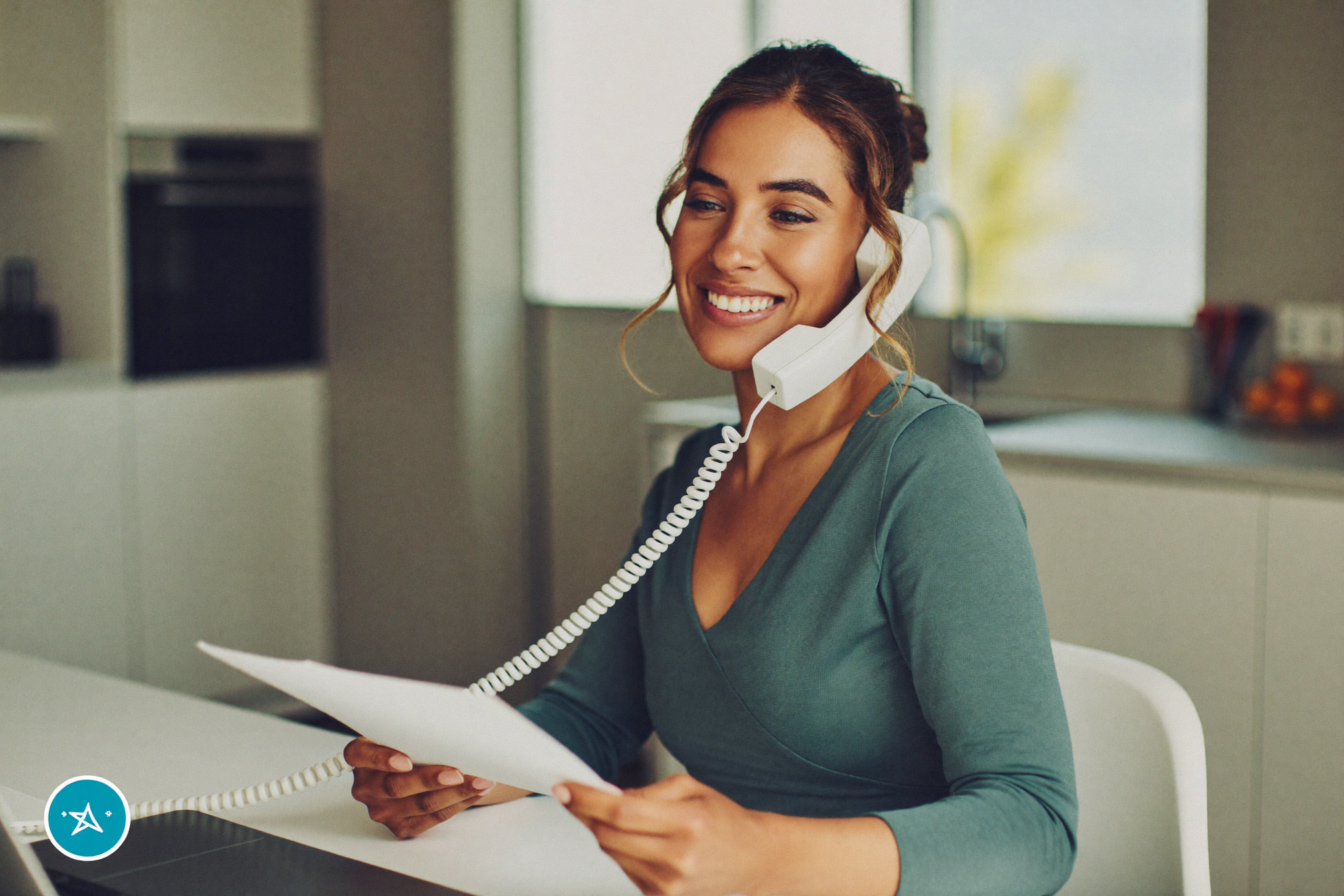 A woman on a call reviewing paperwork with confidence