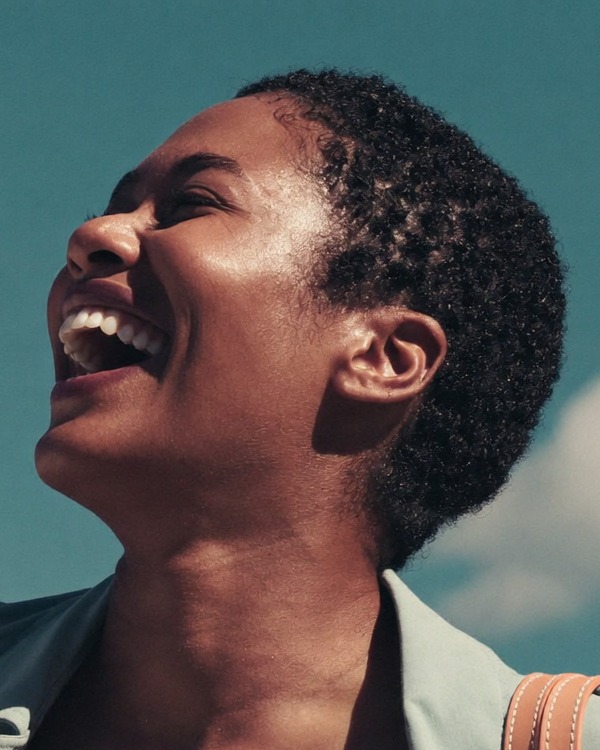 A confident woman at ease outdoors, some time after her reduction