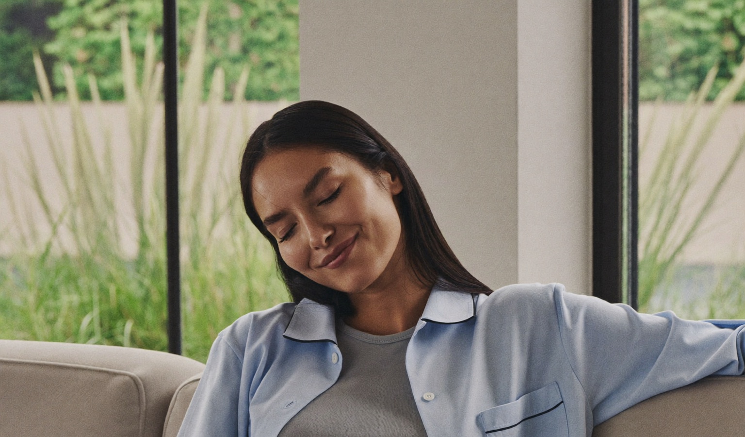 A calm woman resting comfortably at home during recovery